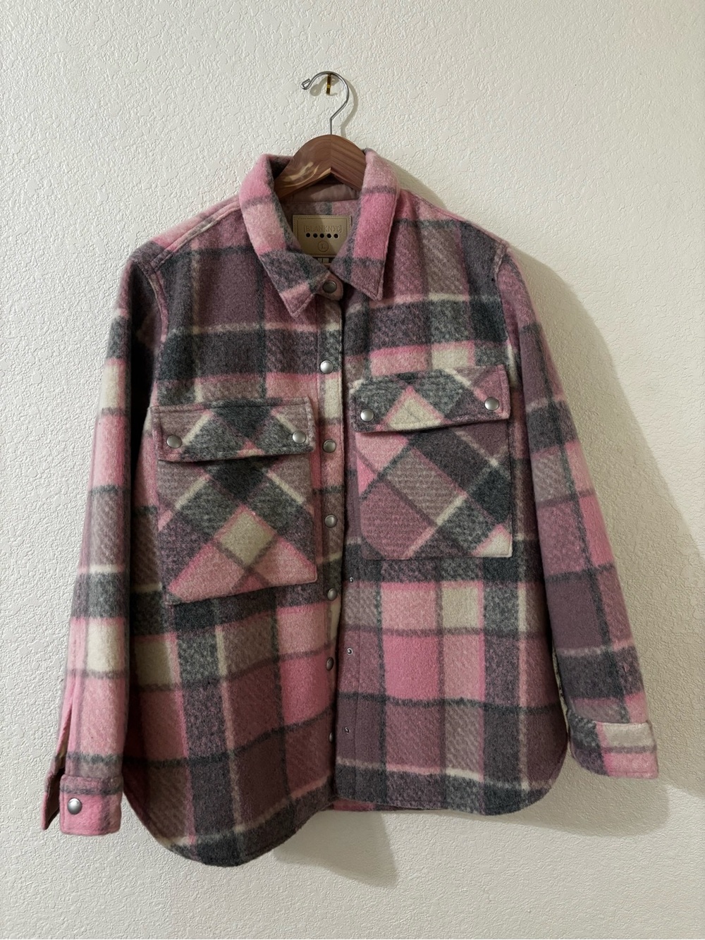 Pink and grey women’s plaid shirt jacket with snap closure